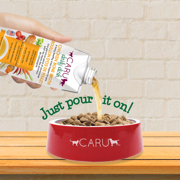 Caru Daily Dish chicken bone broth poured over dry food to add moisture and flavor