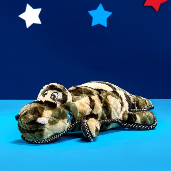 ZippyPaws Z-Stitch Camron the Camo Gator Plush Dog Toy, toy on a patriotic backdrop